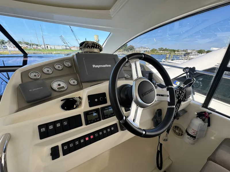 Slide: The Image of Prestige 440 S 2012 yacht helm with steering wheel and navigation controls. - 24