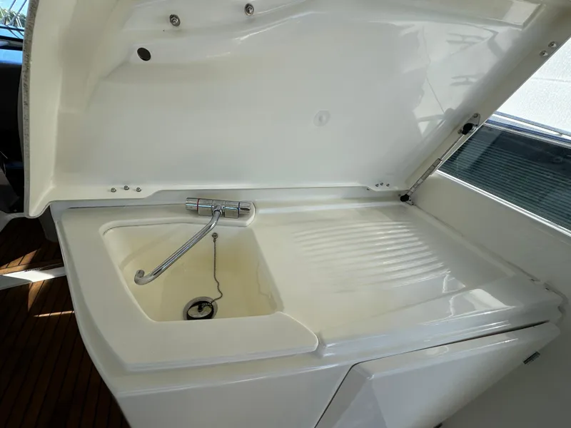 Slide: The Image of Prestige 440 S 2012 yacht sink with open lid and faucet. - 25