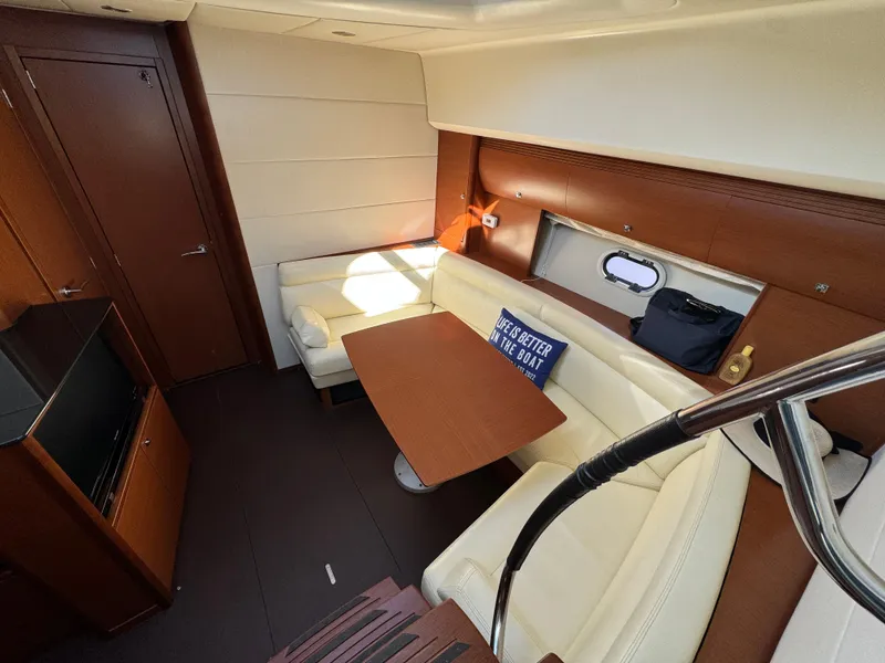 Slide: The Image of Luxurious interior of 2012 Prestige 440 S yacht with cozy seating and table. - 28