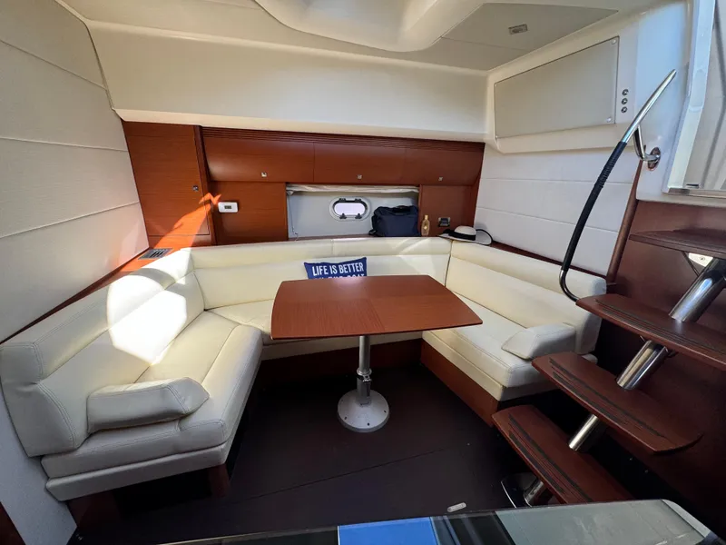 Slide: The Image of Luxurious interior of 2012 Prestige 440 S yacht with cozy seating and table. - 32
