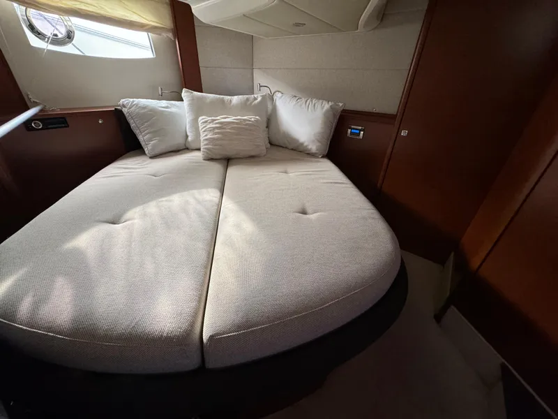 Slide: The Image of Luxurious cabin interior of 2012 Prestige 440 S yacht with cozy bed and pillows. - 33