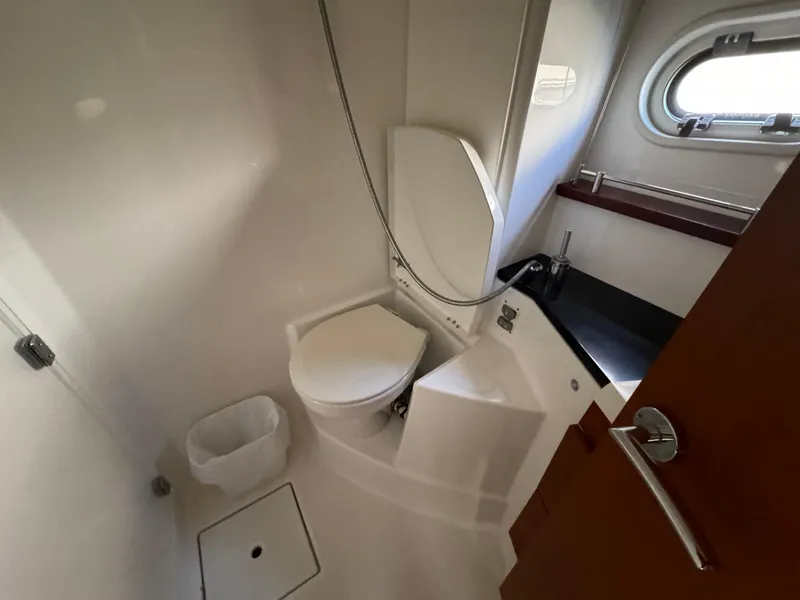 Slide: The Image of Compact bathroom in 2012 Prestige 440 S yacht with toilet and sink. - 34
