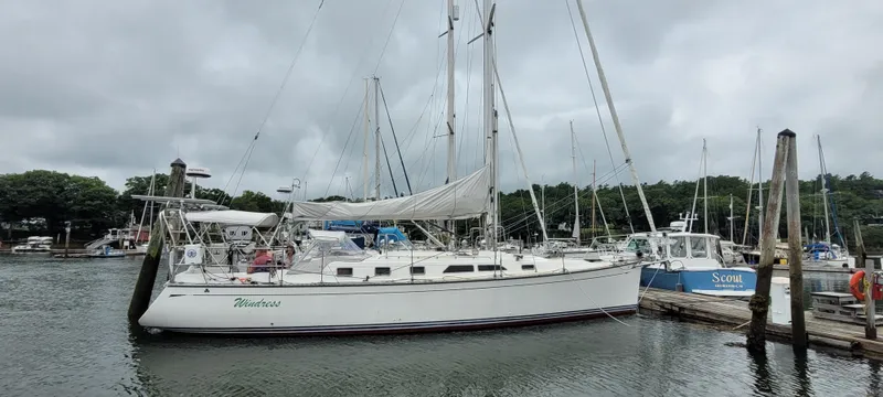 The Image of Sailboat docked in marina, Saga 43 model, 1997, overcast sky, calm water. - 0
