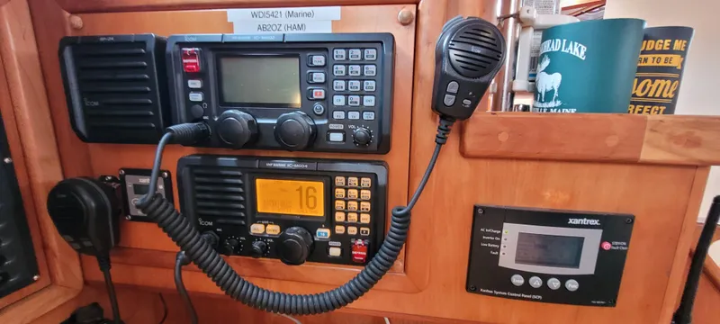 Slide: The Image of Boat communication equipment with radio and control panel on a 1997 Saga 43. - 16