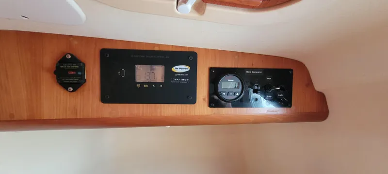 Slide: The Image of Control panel of a 1997 Saga 43 boat with various gauges and displays. - 18
