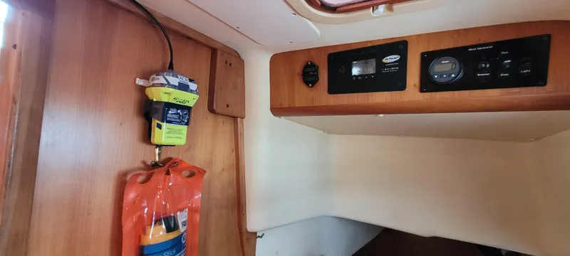 Slide: The Image of Interior of 1997 Saga 43 boat with control panel and safety equipment. - 19