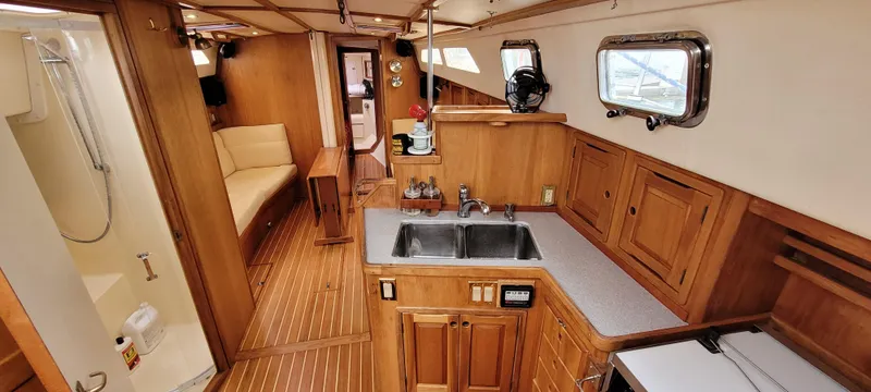 Slide: The Image of Interior of 1997 Saga 43 yacht with wooden cabinetry and modern amenities. - 3