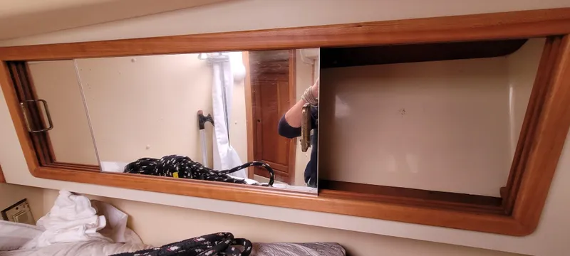 Slide: The Image of Mirror with wooden frame inside a 1997 Saga 43 boat cabin. - 35