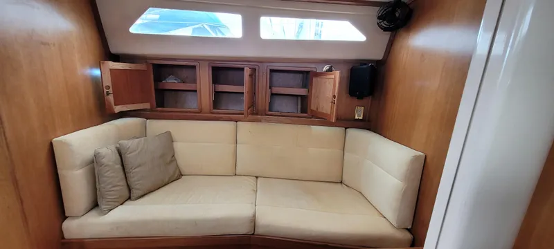 Slide: The Image of Interior of 1997 Saga 43 yacht with beige seating and wooden cabinets. - 40