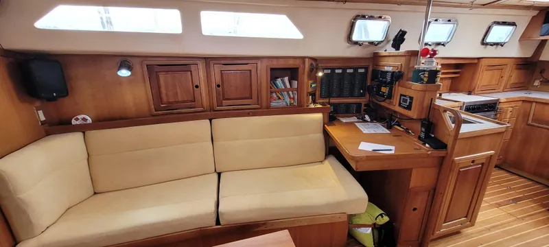 Slide: The Image of Interior of 1997 Saga 43 yacht with wooden cabinetry and beige seating. - 41