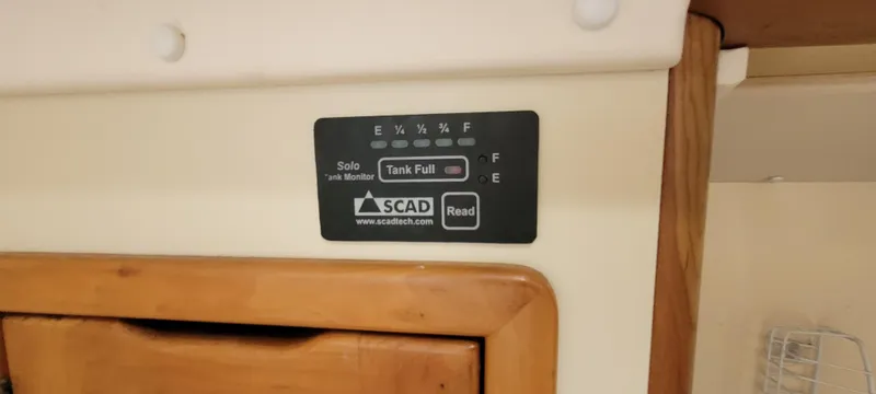 Slide: The Image of SCAD tank monitor on 1997 Saga 43, indicating full tank status. - 42