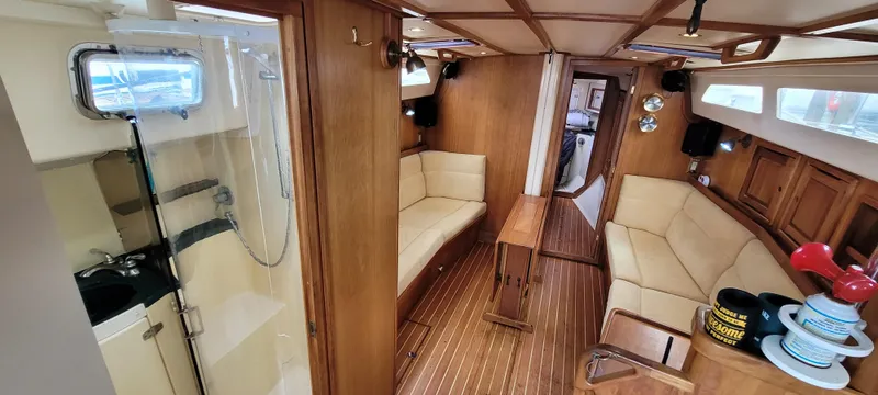 Slide: The Image of Interior of 1997 Saga 43 yacht with wooden furnishings and cozy seating area. - 46
