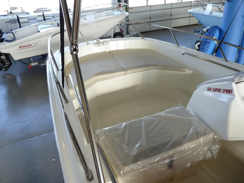 Slide: The Image of 2024 Boston Whaler 160 Super Sport boat interior in showroom. - 8