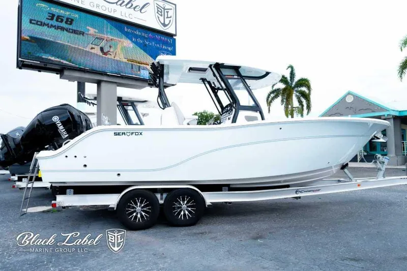 Slide: The Image of 2025 Sea Fox 288 Commander Center Console boat on trailer at dealership. - 0