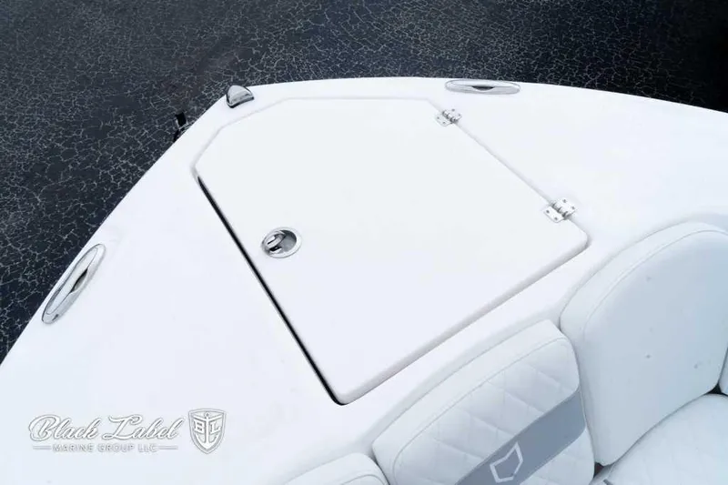 Slide: The Image of 2025 Sea Fox 288 Commander Center Console boat deck with storage compartment. - 12