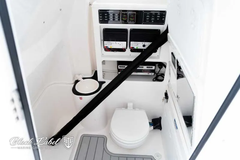 Slide: The Image of 2025 Sea Fox 288 Commander Center Console interior with toilet and control panels. - 14