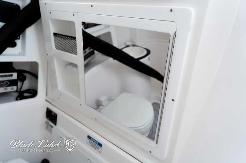 Slide: The Image of Interior of 2025 Sea Fox 288 Commander Center Console, featuring a compact marine toilet. - 15