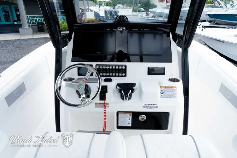 Slide: The Image of 2025 Sea Fox 288 Commander Center Console dashboard with steering wheel and controls. - 18