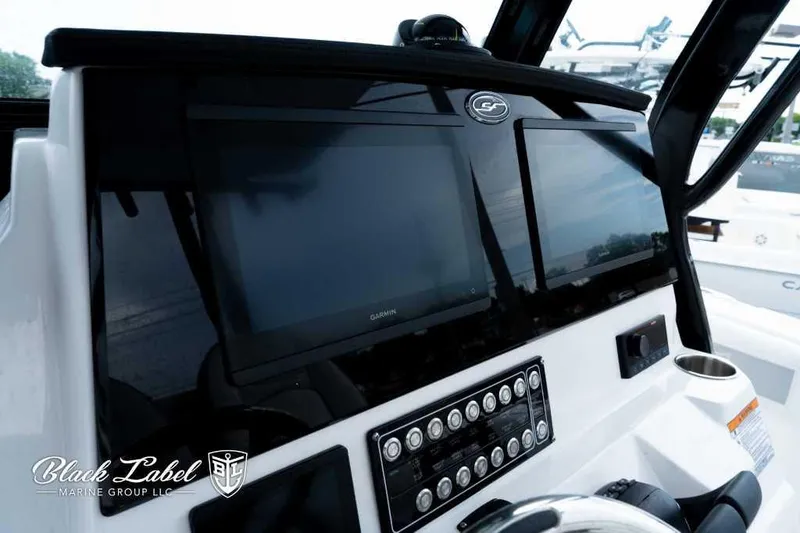 Slide: The Image of 2025 Sea Fox 288 Commander Center Console dashboard with dual Garmin displays. - 20