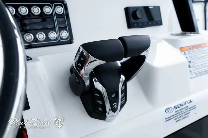 Slide: The Image of Close-up of 2025 Sea Fox 288 Commander Center Console controls and dashboard. - 24