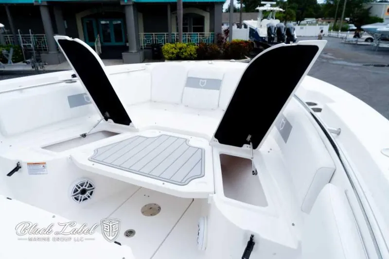 Slide: The Image of 2025 Sea Fox 288 Commander Center Console boat interior with open storage compartments. - 7
