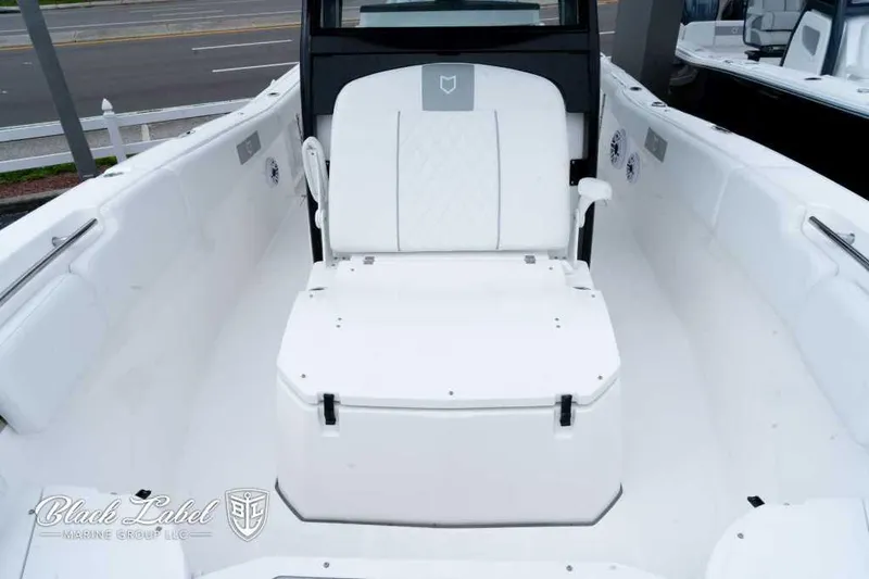 Slide: The Image of 2025 Sea Fox 288 Commander Center Console boat interior with seating and storage. - 8