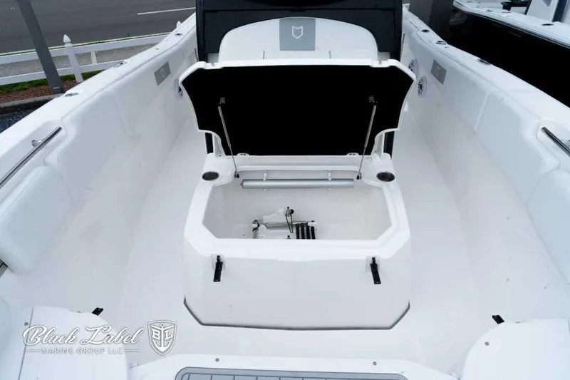Slide: The Image of 2025 Sea Fox 288 Commander Center Console boat interior with open storage compartment. - 9