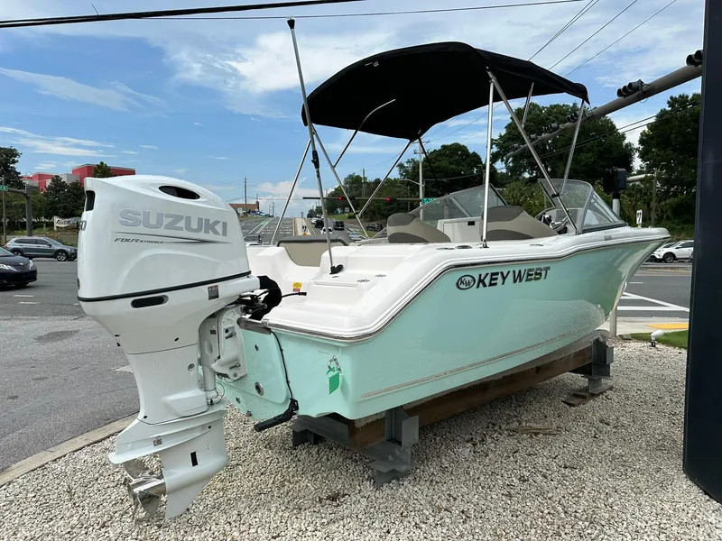 Slide: The Image of 2025 Key West 203 DFS boat with Suzuki outboard motor on display. - 3
