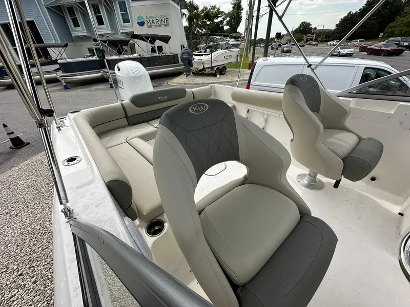Slide: The Image of 2025 Key West 203 DFS boat interior with cushioned seating and modern design. - 9