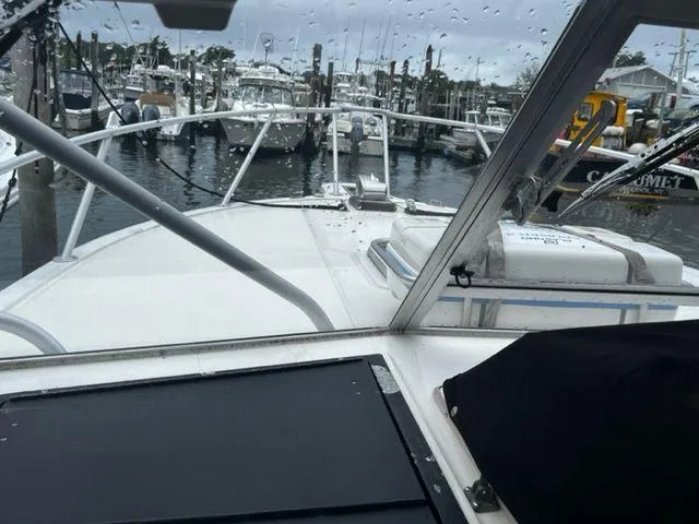 Slide: The Image of 1996 Albemarle 305 boat docked at marina on a rainy day. - 10