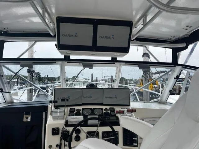 Slide: The Image of 1996 Albemarle 305 boat cockpit with Garmin navigation displays. - 6