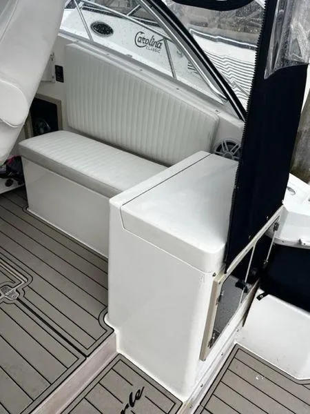 Slide: The Image of 1996 Albemarle 305 boat interior with white seating and sleek design. - 7
