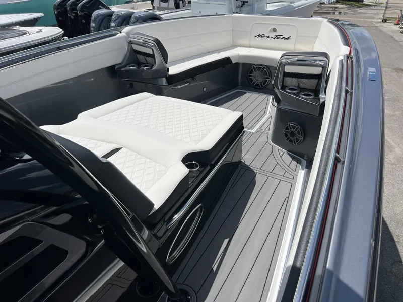 Slide: The Image of 2025 Nor-Tech 390 Sport Center Console with luxurious seating and modern design. - 12