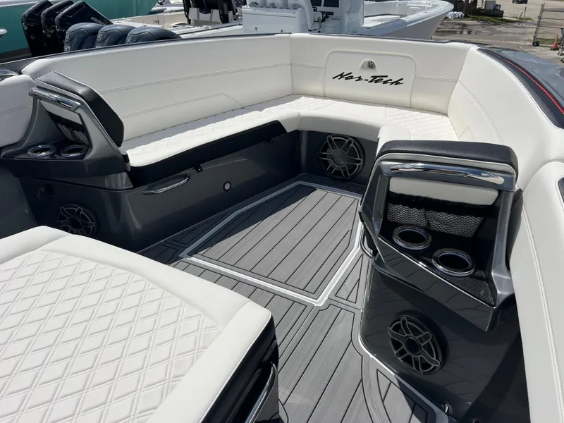 Slide: The Image of 2025 Nor-Tech 390 Sport Center Console interior with luxurious seating and modern design. - 13