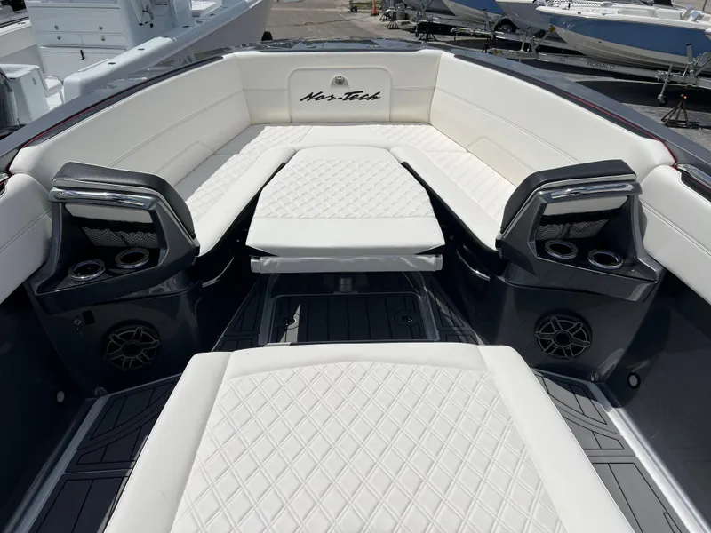Slide: The Image of 2025 Nor-Tech 390 Sport Center Console with luxurious seating and modern design. - 15