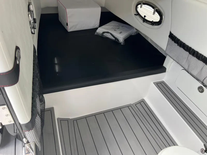 Slide: The Image of Interior of 2025 Nor-Tech 390 Sport Center Console boat, featuring sleek seating and storage. - 24