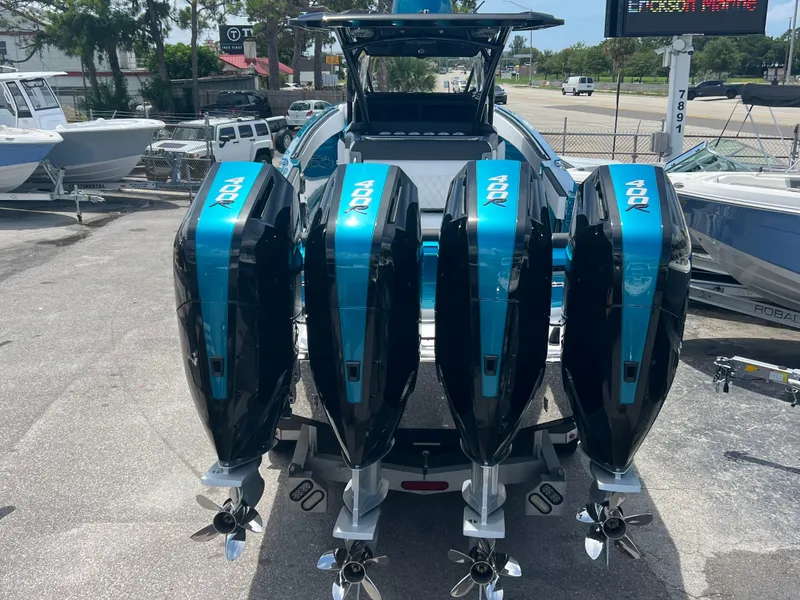 Slide: The Image of 2025 Nor-Tech 390 Sport Center Console with four powerful outboard engines. - 3