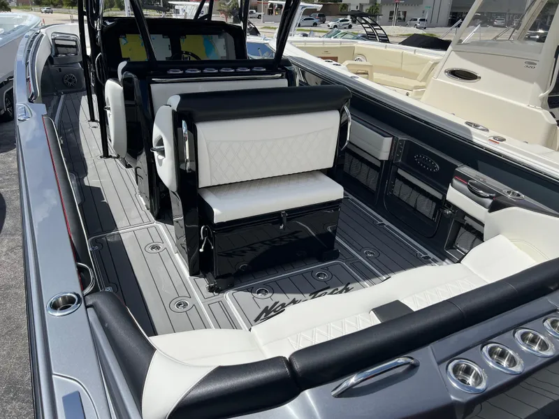 Slide: The Image of 2025 Nor-Tech 390 Sport Center Console interior with luxurious seating and modern design. - 5