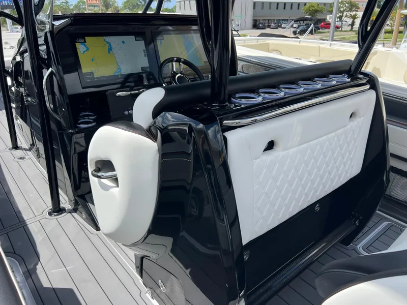 Slide: The Image of 2025 Nor-Tech 390 Sport Center Console interior with sleek black and white design, advanced navigation system. - 8