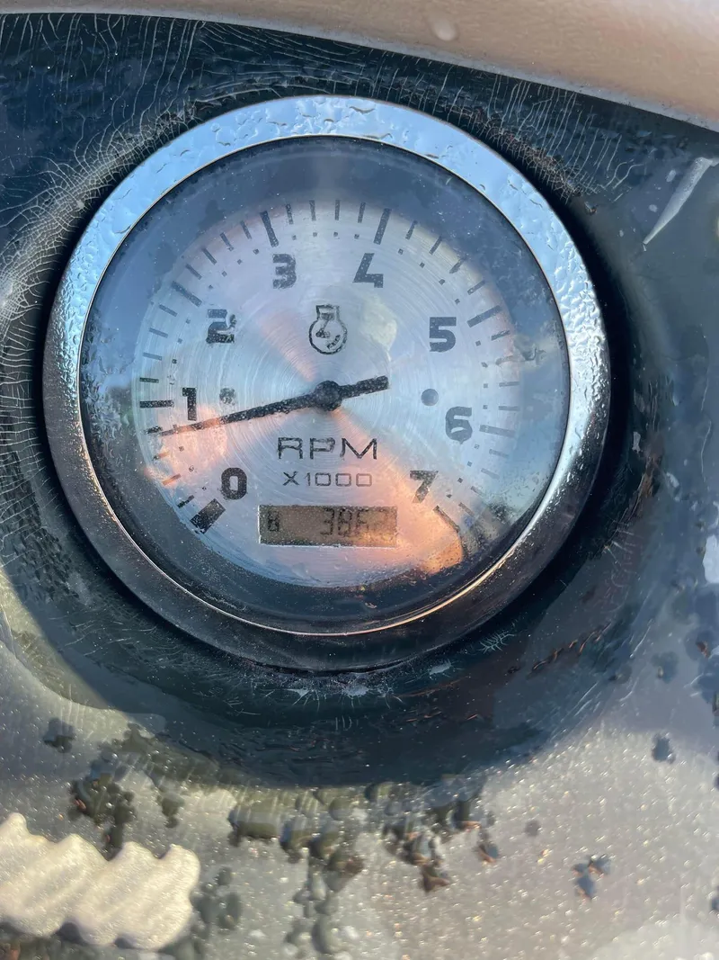 Slide: The Image of Close-up of 2017 Manitou 25 Oasis RPM gauge displaying 3800 RPM. - 3