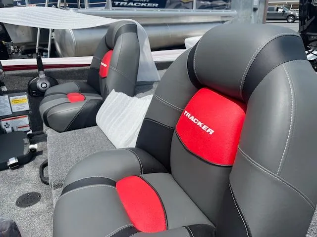 Slide: The Image of 2025 Tracker Pro Team 175 TXW boat seats, featuring gray and red cushioned design. - 2
