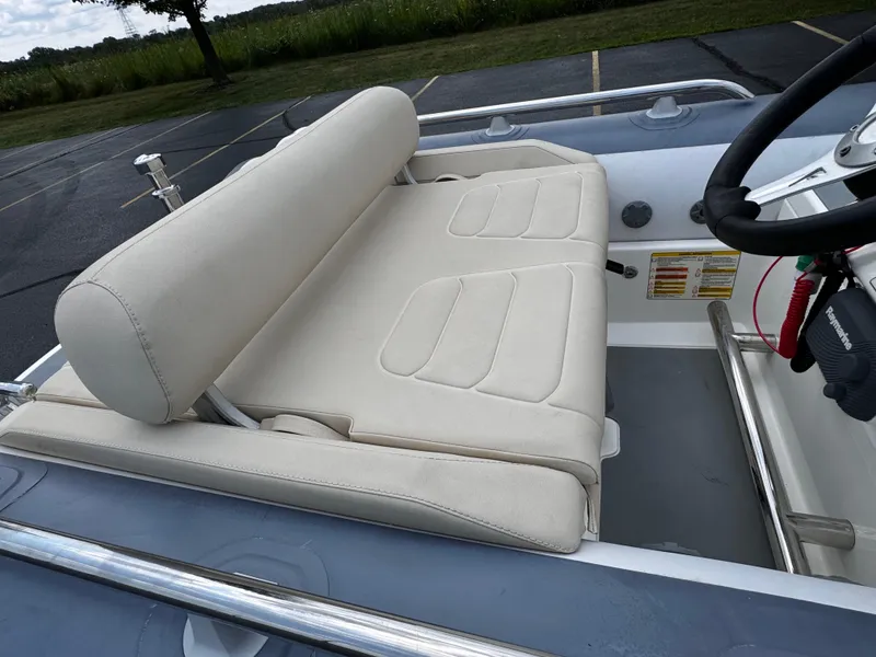 Slide: The Image of 2019 Williams Jet Tenders Sportjet 395, beige seating, outdoor setting. - 13