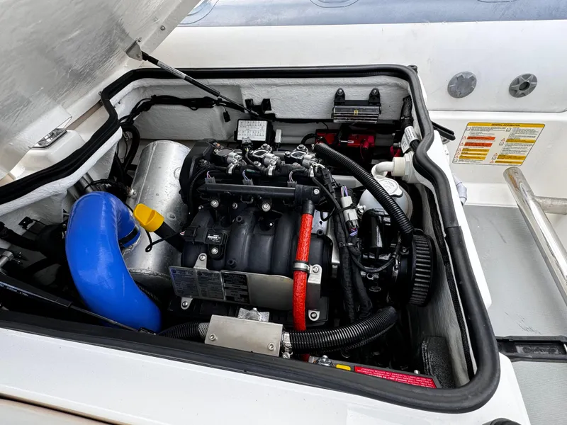 Slide: The Image of Engine compartment of 2019 Williams Jet Tenders Sportjet 395, showcasing detailed mechanical components. - 16