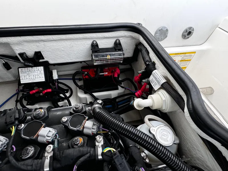 Slide: The Image of Engine compartment of 2019 Williams Jet Tenders Sportjet 395, showcasing wiring and components. - 17