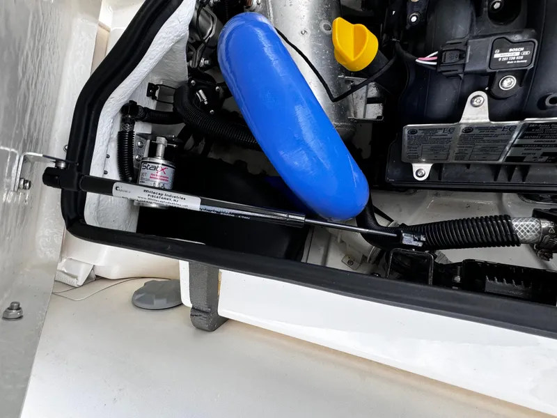 Slide: The Image of Engine compartment of 2019 Williams Jet Tenders Sportjet 395, featuring mechanical components. - 19