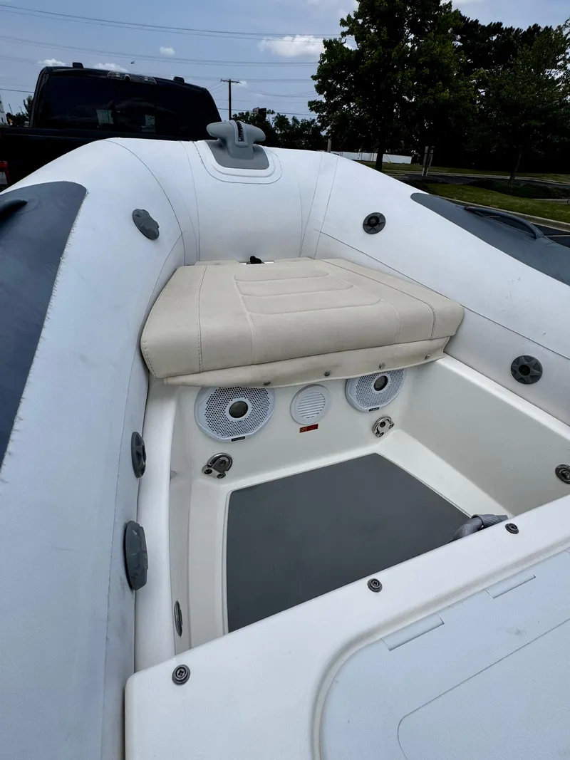 Slide: The Image of 2019 Williams Jet Tenders Sportjet 395, white interior, outdoor setting. - 21