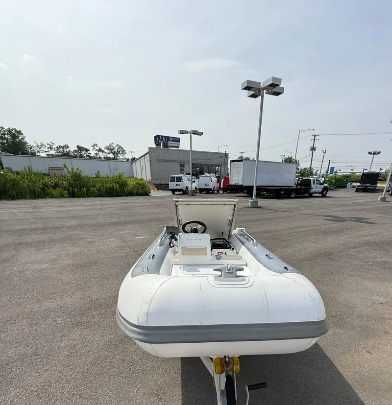 Slide: The Image of 2019 Williams Jet Tenders Sportjet 395 in a parking lot, front view. - 28