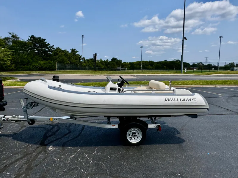 Slide: The Image of 2019 Williams Jet Tenders Sportjet 395 on trailer in parking lot. - 3