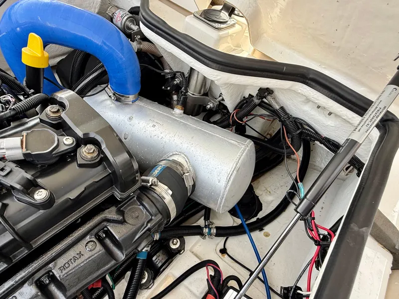 Slide: The Image of Engine compartment of a 2019 Williams Jet Tenders Sportjet 395, showcasing detailed components. - 31