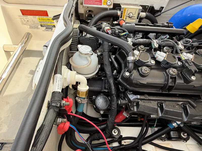 Slide: The Image of 2019 Williams Jet Tenders Sportjet 395 engine compartment with detailed wiring and components. - 32